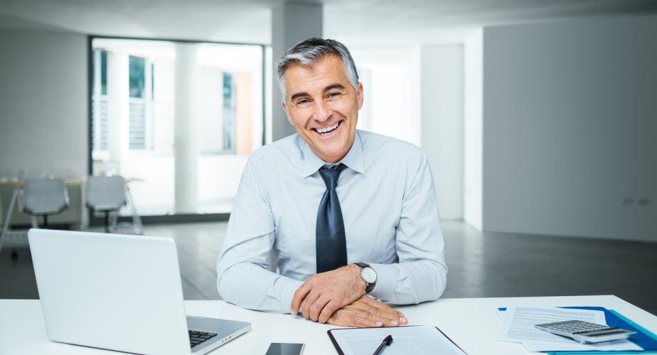 Man smiling in a modern office